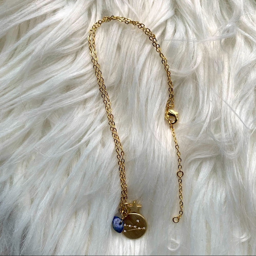 Francesca’s Gold Taurus Zodiac Necklace with Blue Stone and Star Charms
